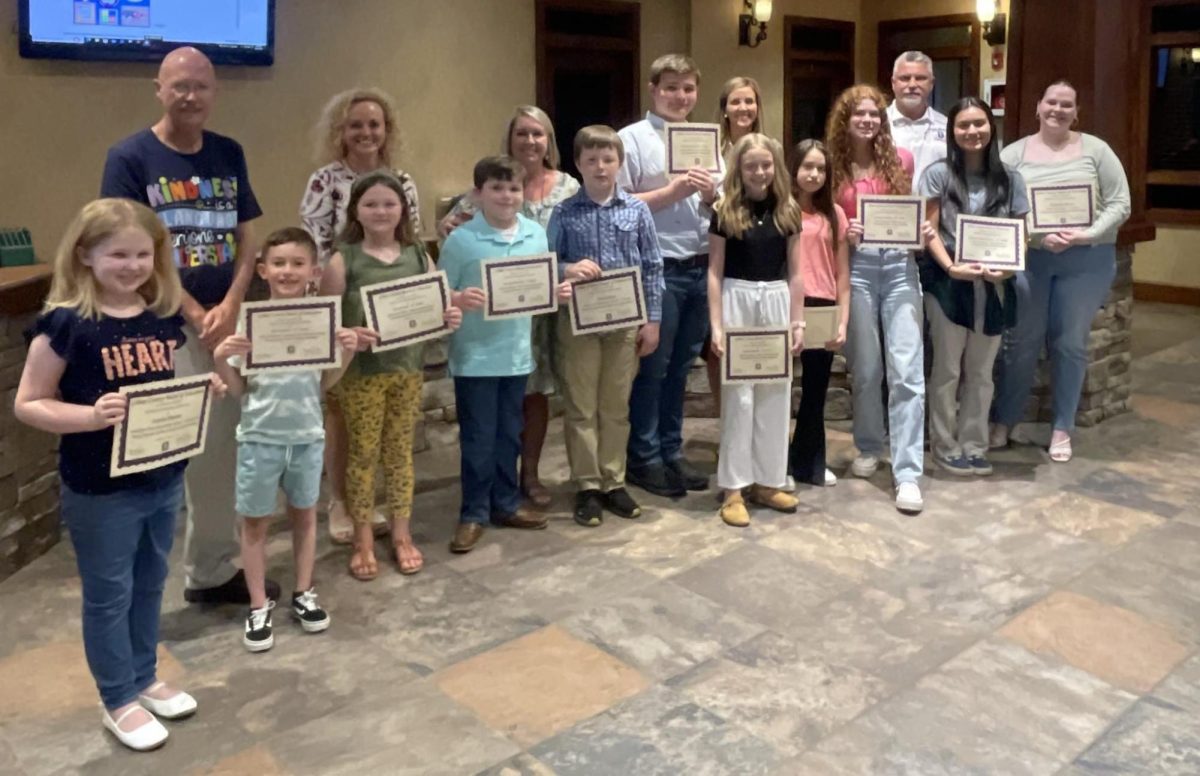 Gilmer county students are presented with certificates for winning the Young Georgia Authors competition. Senior Elizabeth Warren, far right, will go on to the next level of competition for her short story titled A Life of Two.